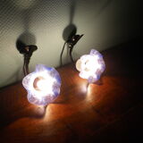 Wall sconces with opalines in the shape of corollas and black metal support