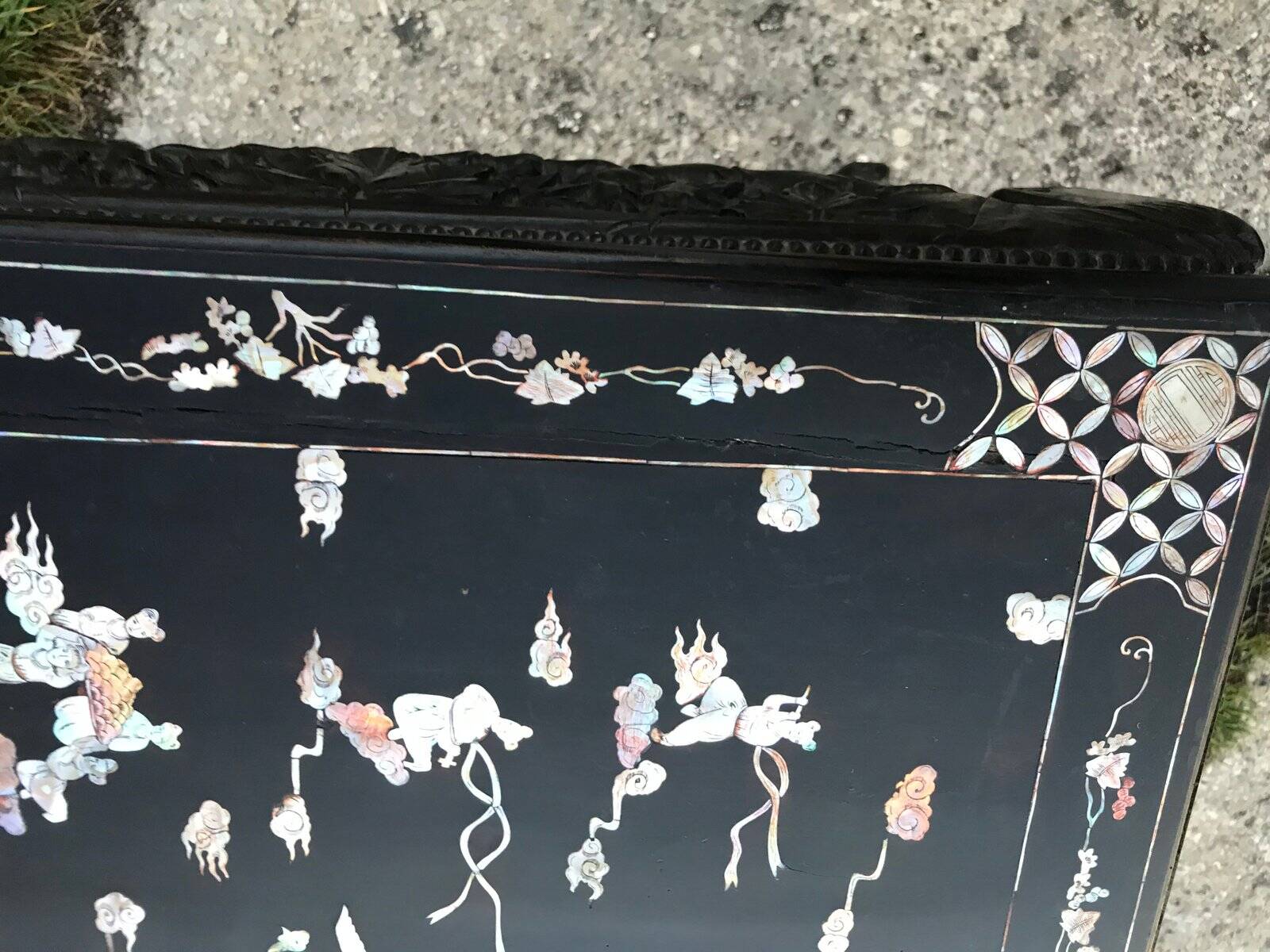 Chinese black lacquer side table with multicoloured inlays, 1950s.