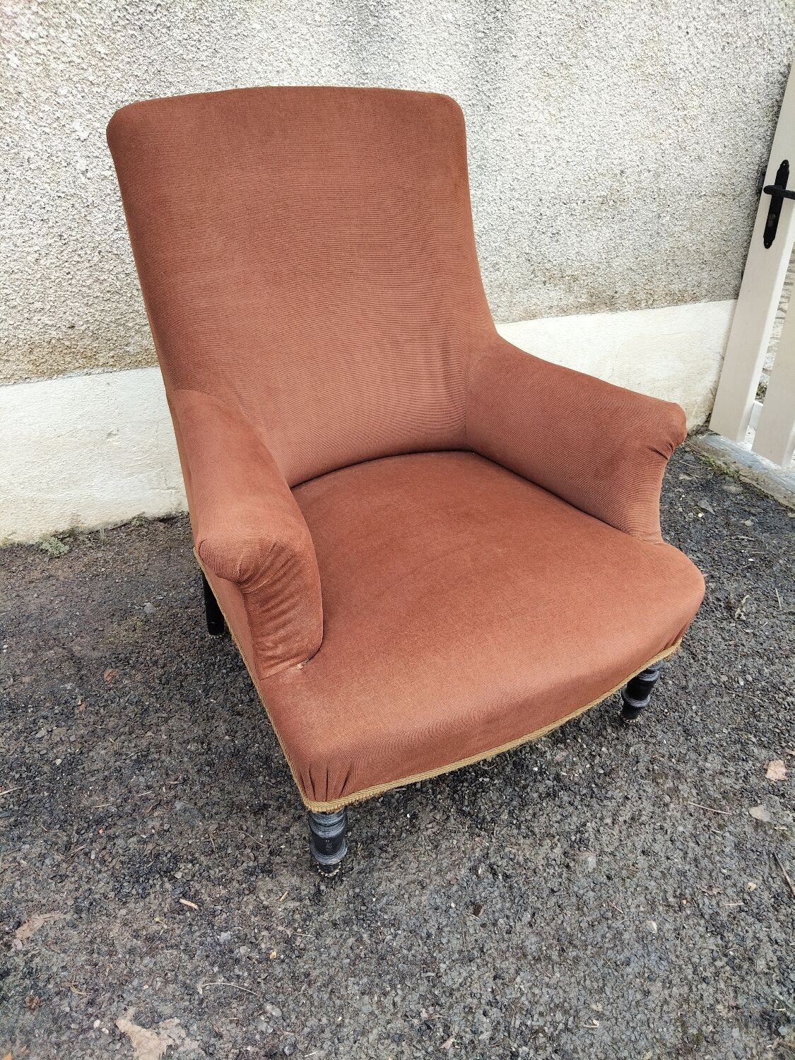 Antique brown velvet tub chair – turned legs and brass rings.