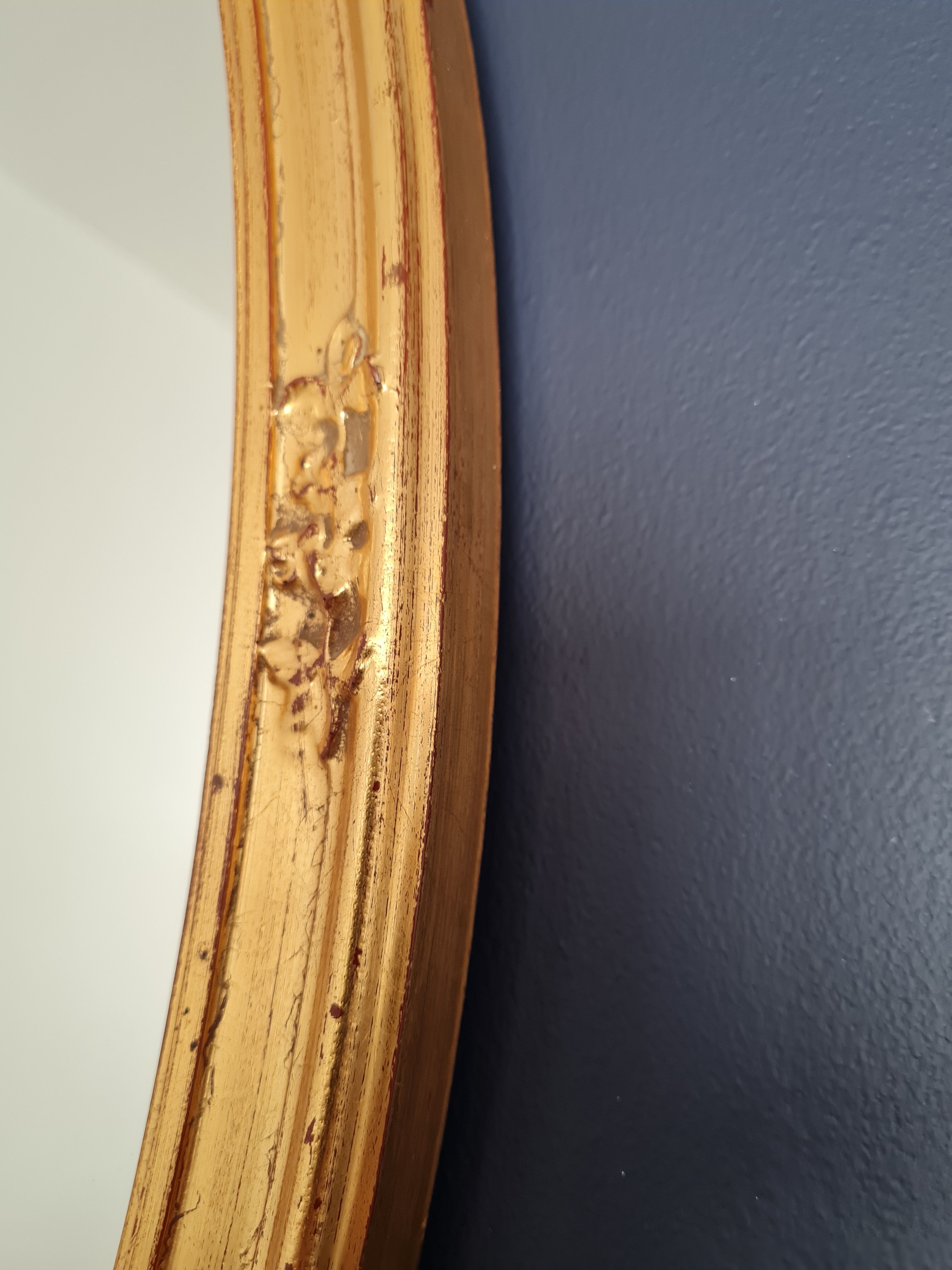 Large oval mirror gilded wood with red plate 44x66cm
