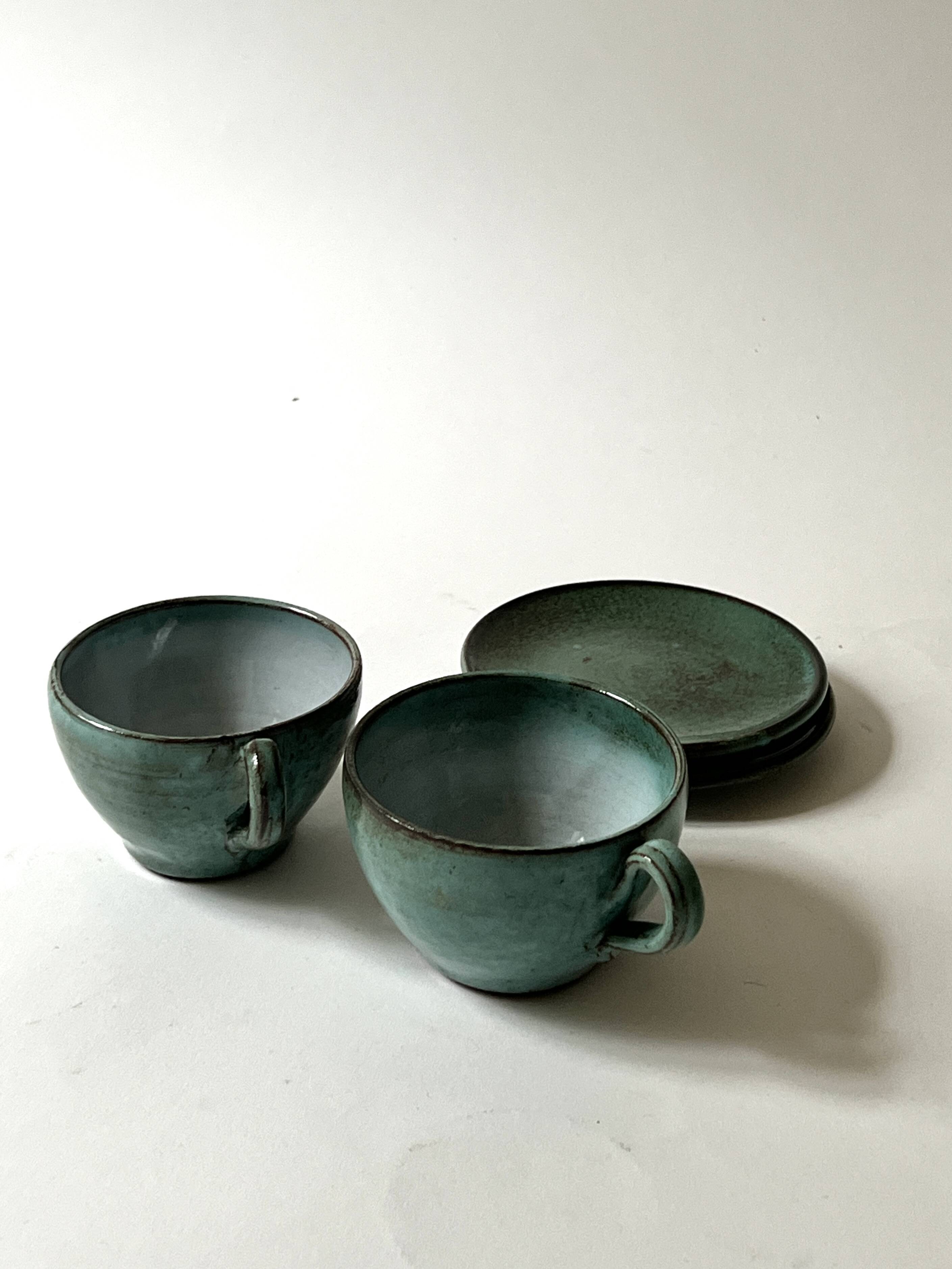 Handmade and signed glazed ceramic coffee cups, circa 1950.
