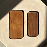 Trio of rounded rectangular trays or cups in monoxyl teak L:35