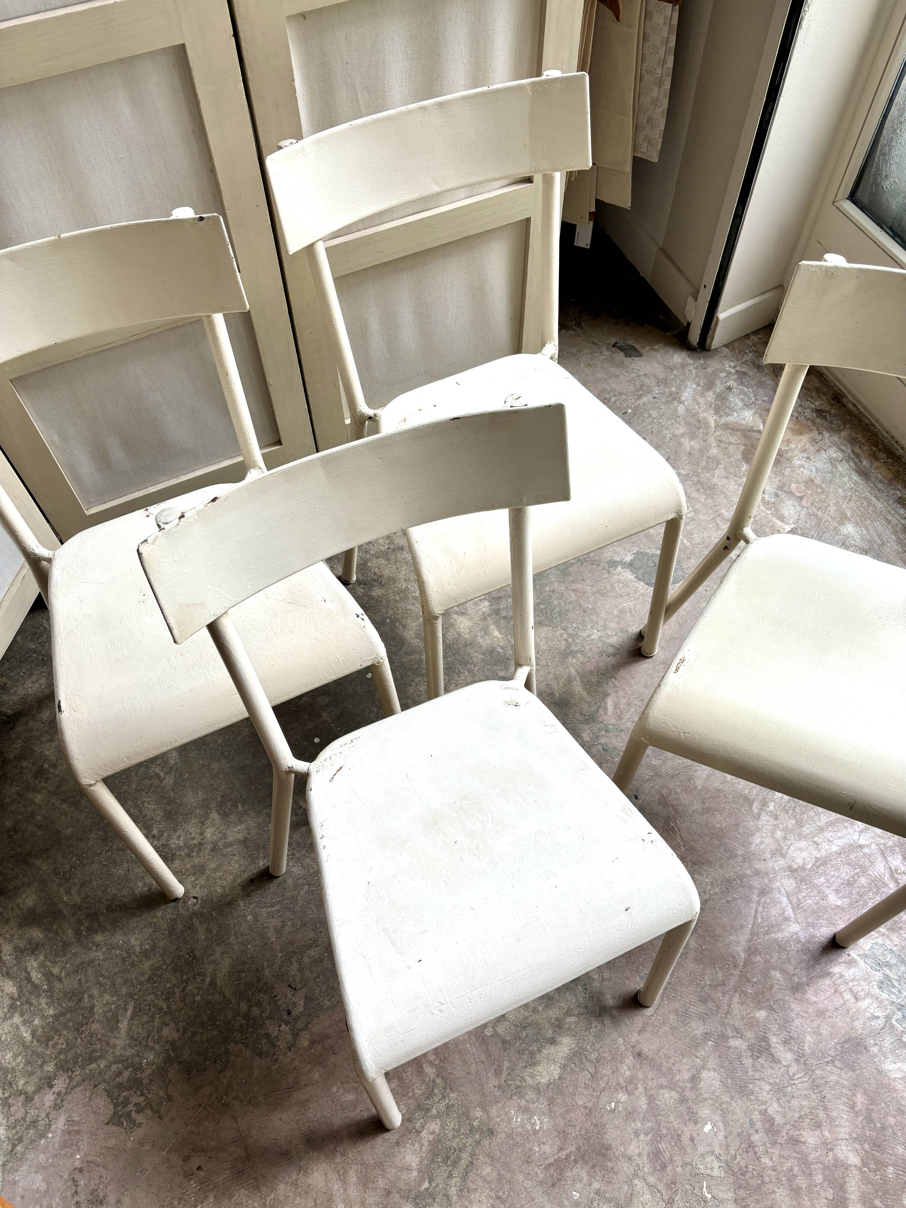 4 beige metal garden chairs