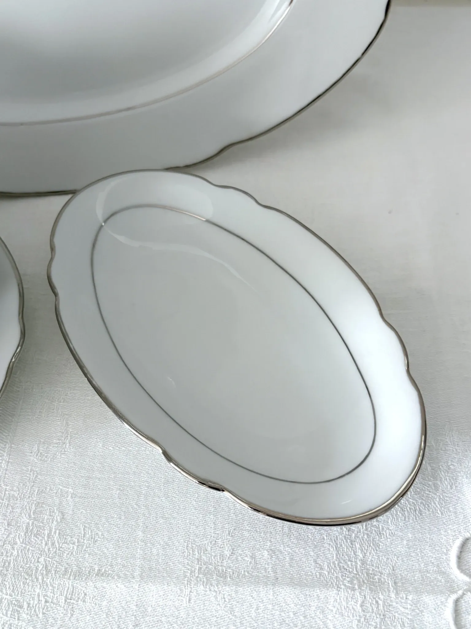 3 white porcelain plates