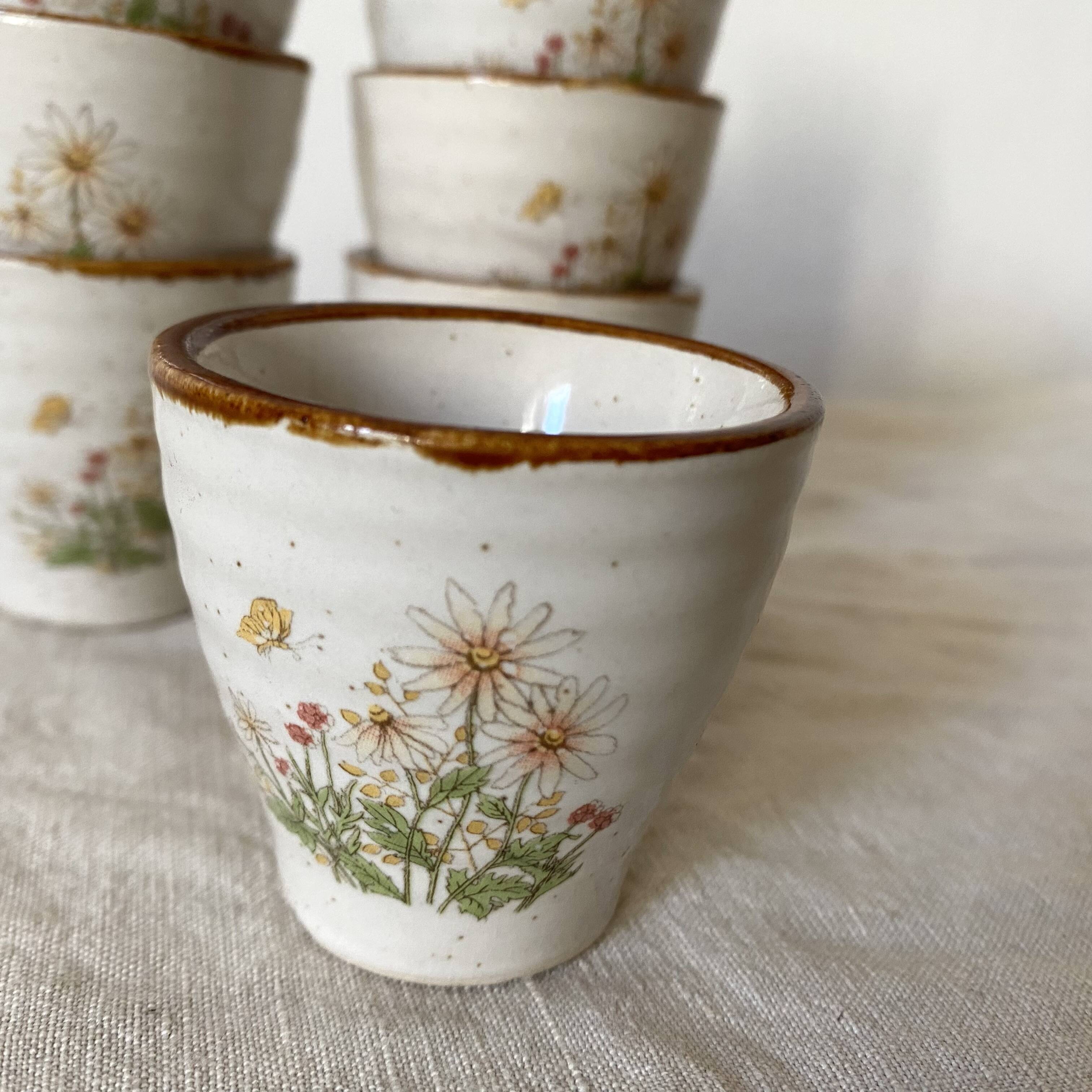 Stoneware egg cups, floral decoration