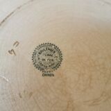 Large old round plate in iron earth