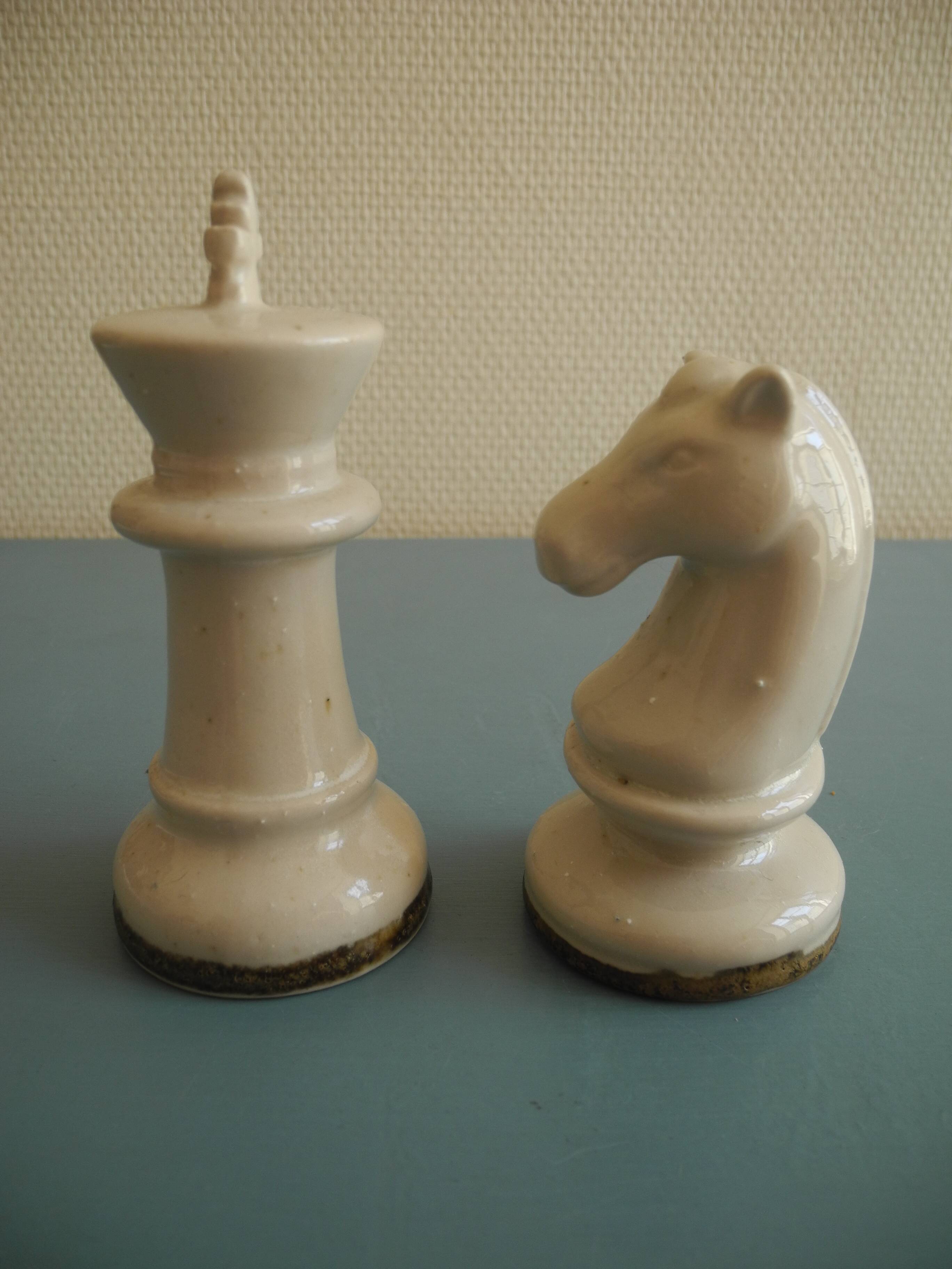 two ceramic chess pieces decorative