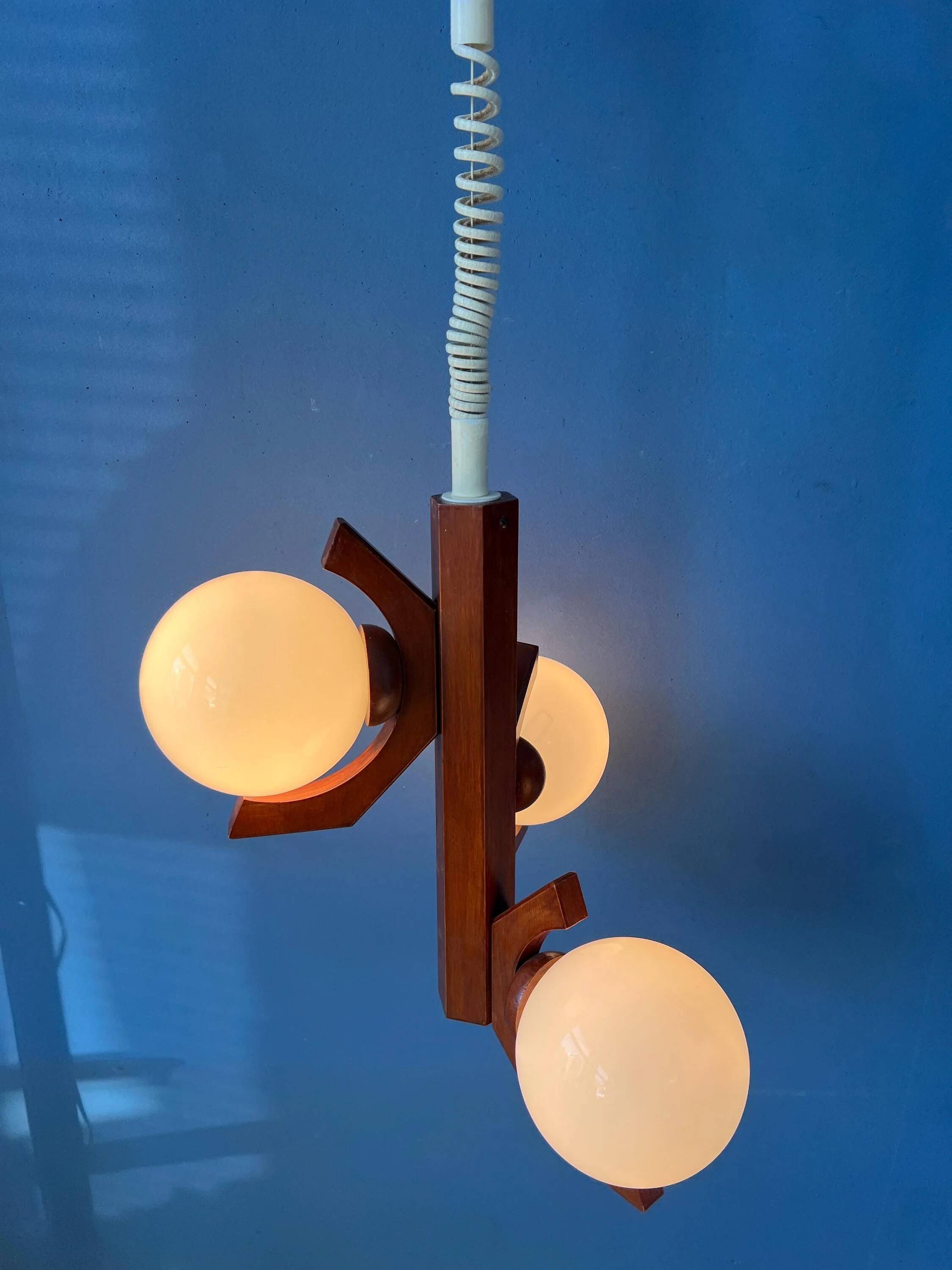 Mid-century brown Bony suspension with opaline glass shade.