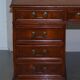 Partner desk with double pedestal in burr yew wood with decorated top.