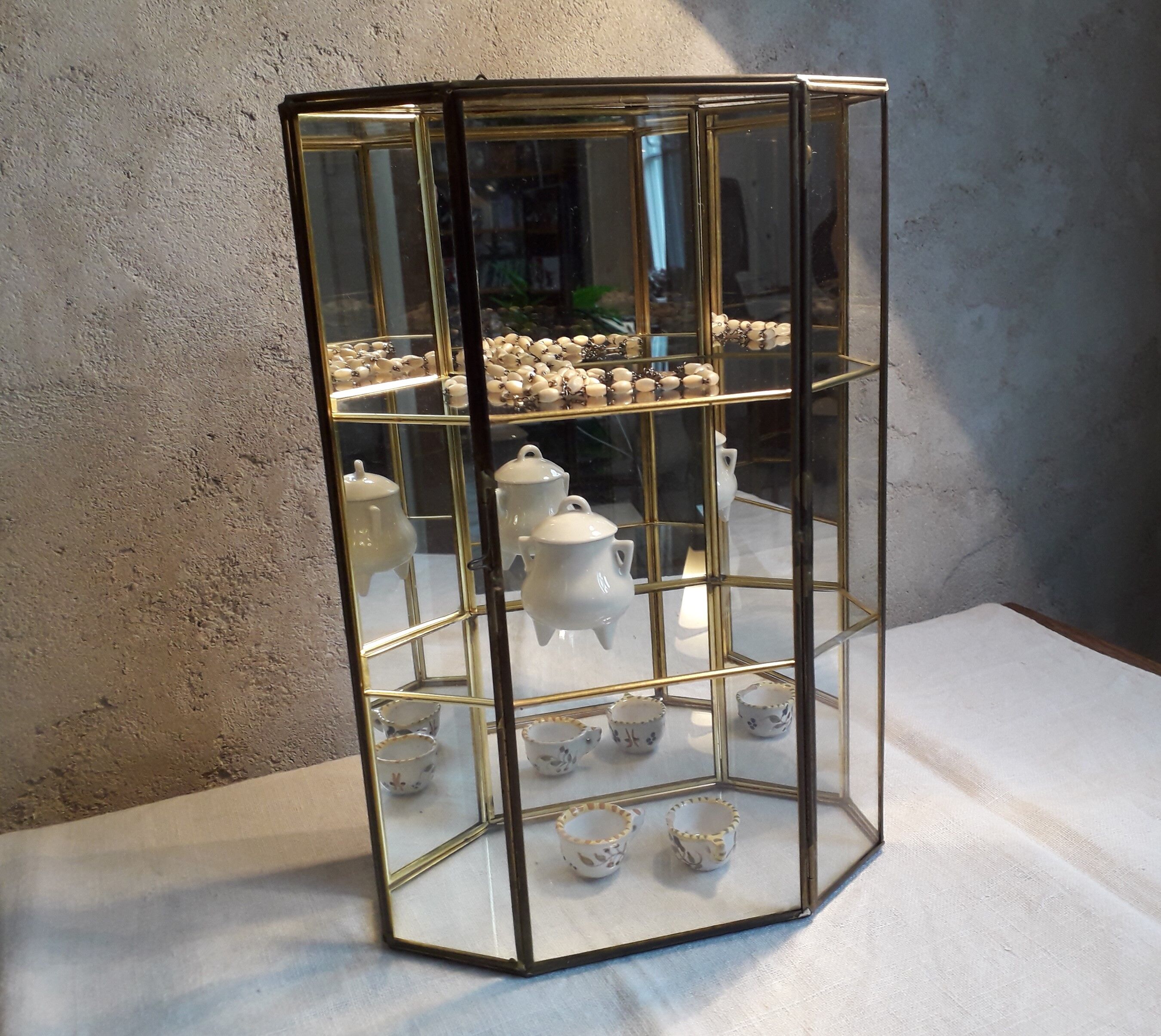 Glass and brass display case for collectibles