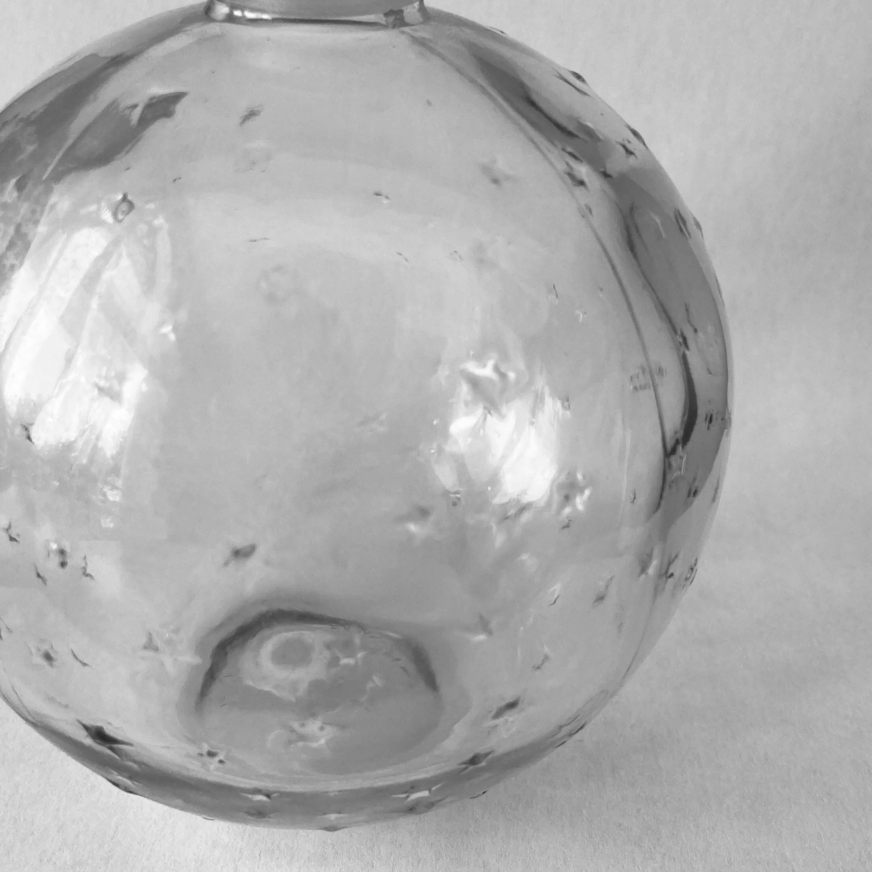Lalique soliflore ball vase in colorless molded glass with light relief decoration of a seedling of stars