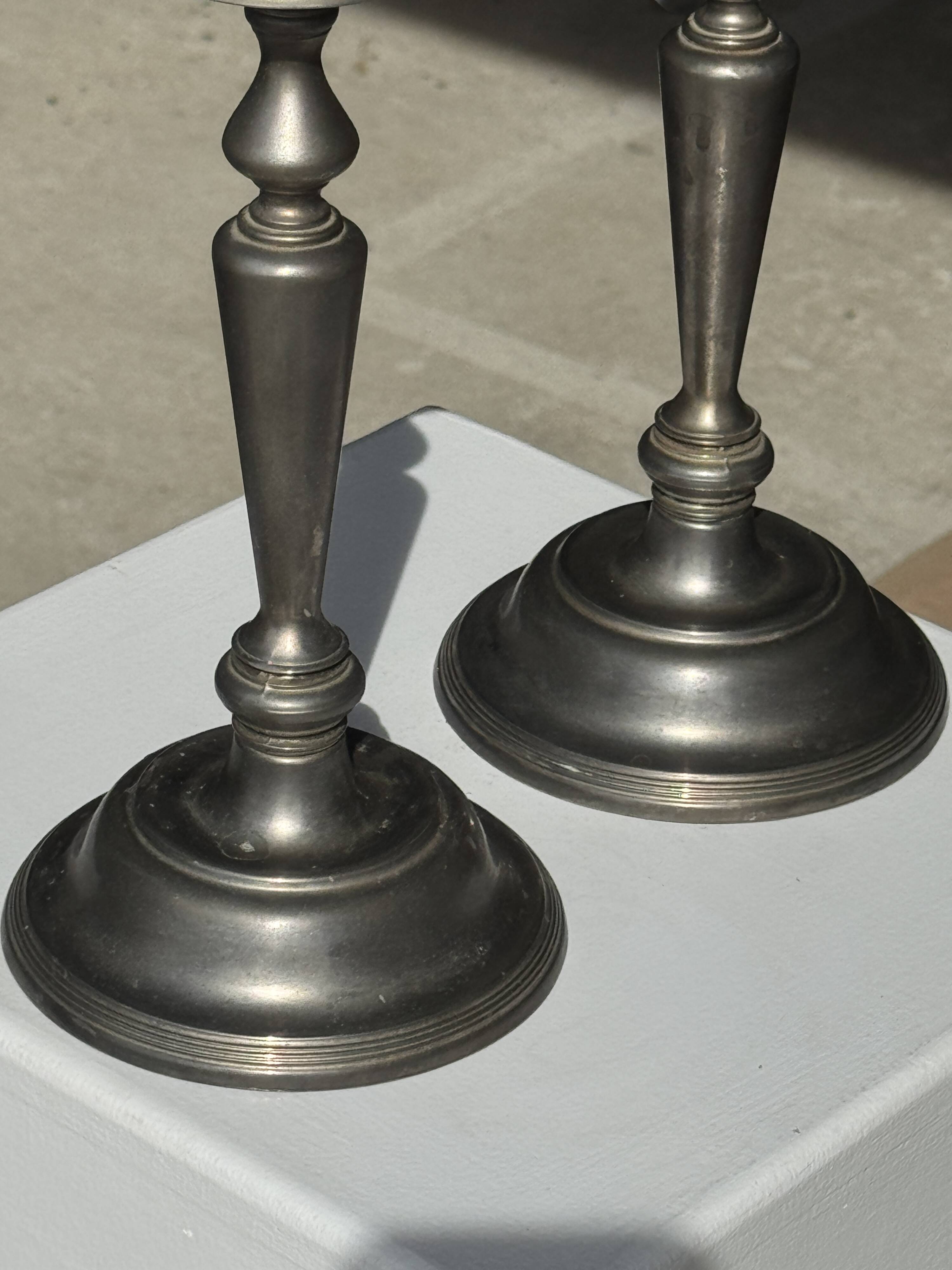 Two large antique silver-plated metal candlesticks, H30