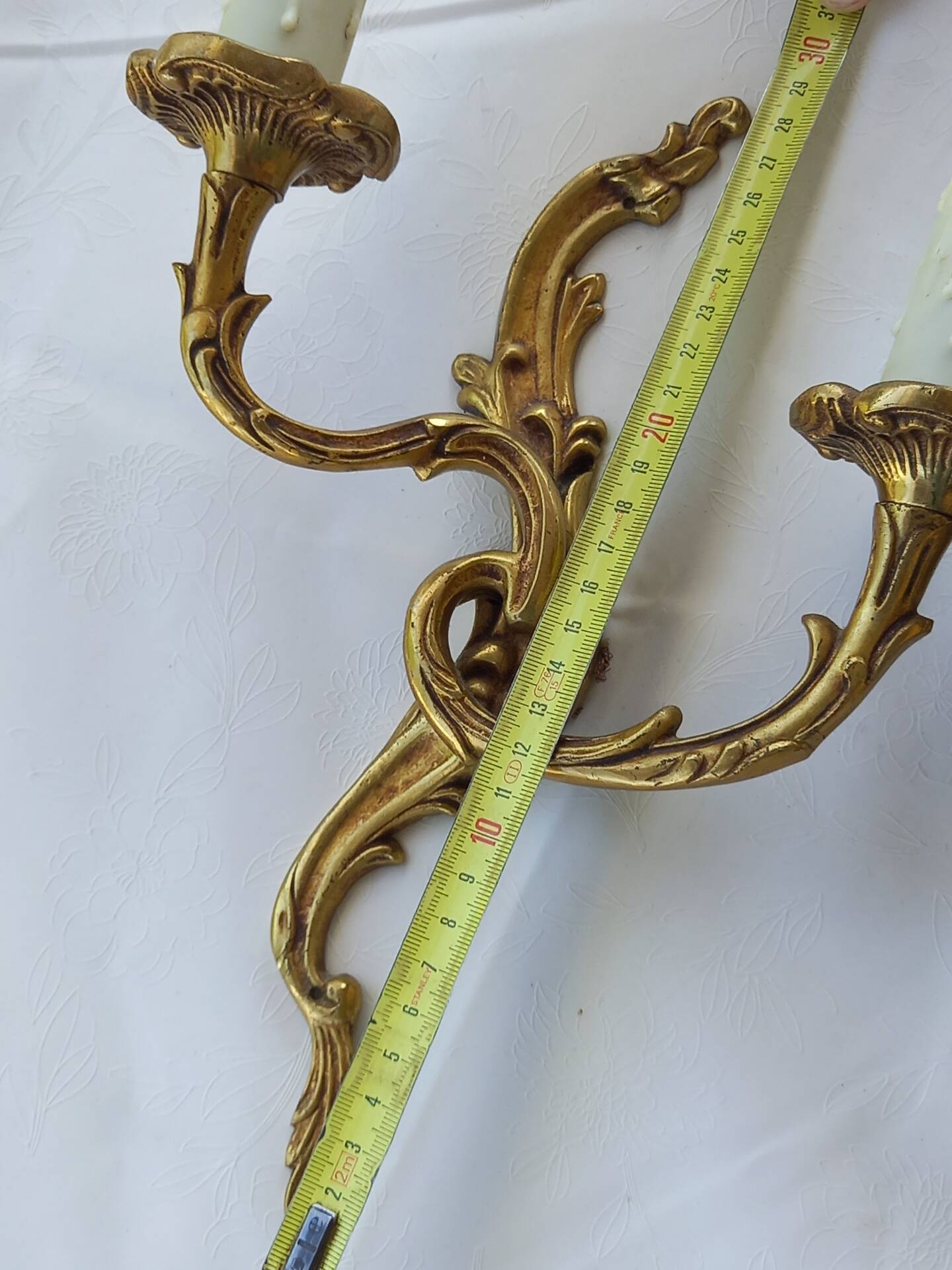 Old pairs of bronze wall sconces