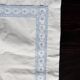 Vintage embroidered pillowcase with light blue thread.