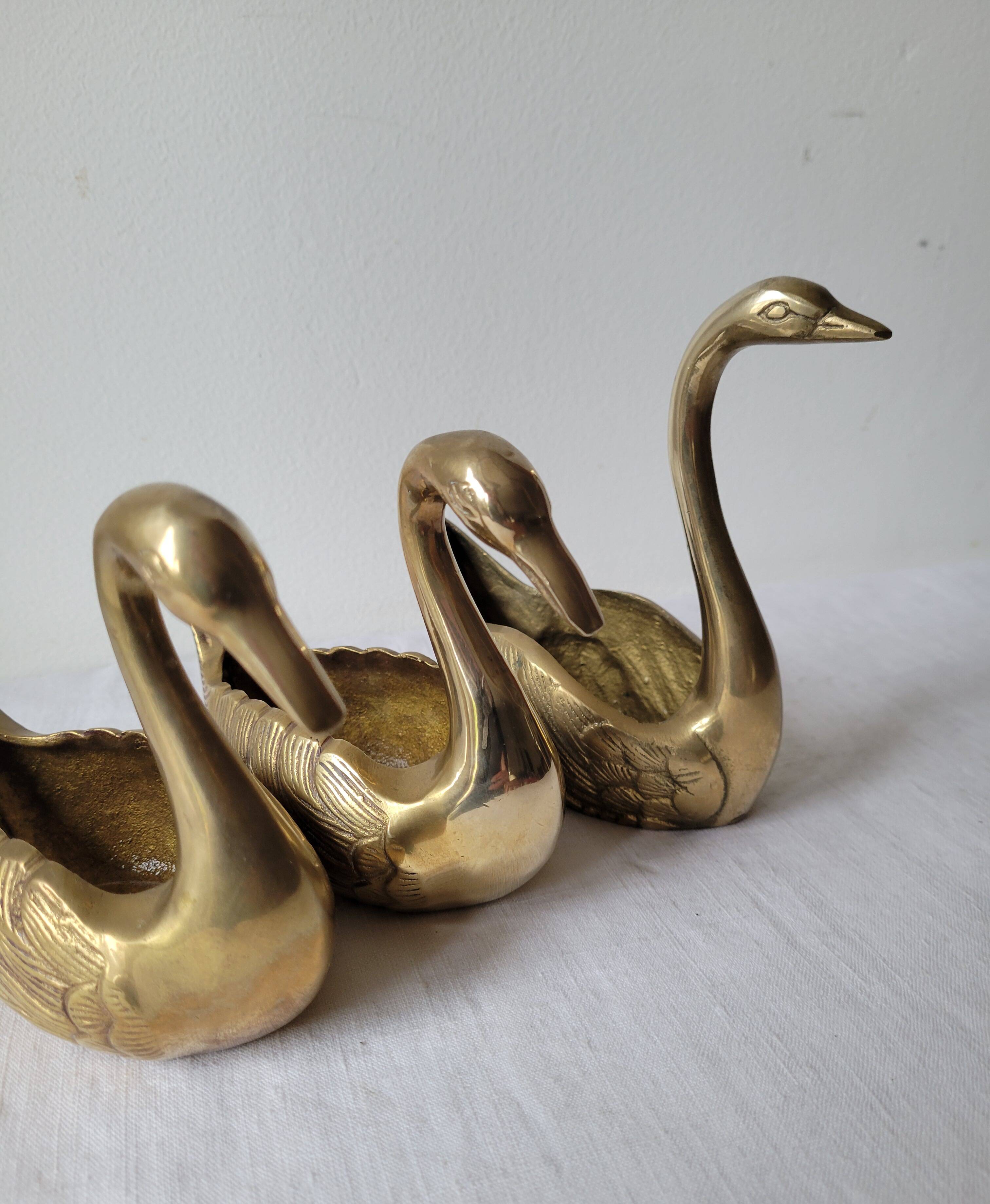 Trio of zoomorphic brass swan empty pockets