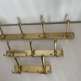 Three vintage 1960s gold coat racks 4, 3 and 2 hooks
