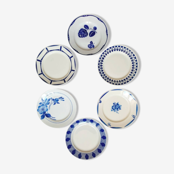 Old mismatched earthenware dinner plates