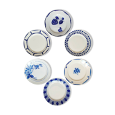Old mismatched earthenware dinner plates
