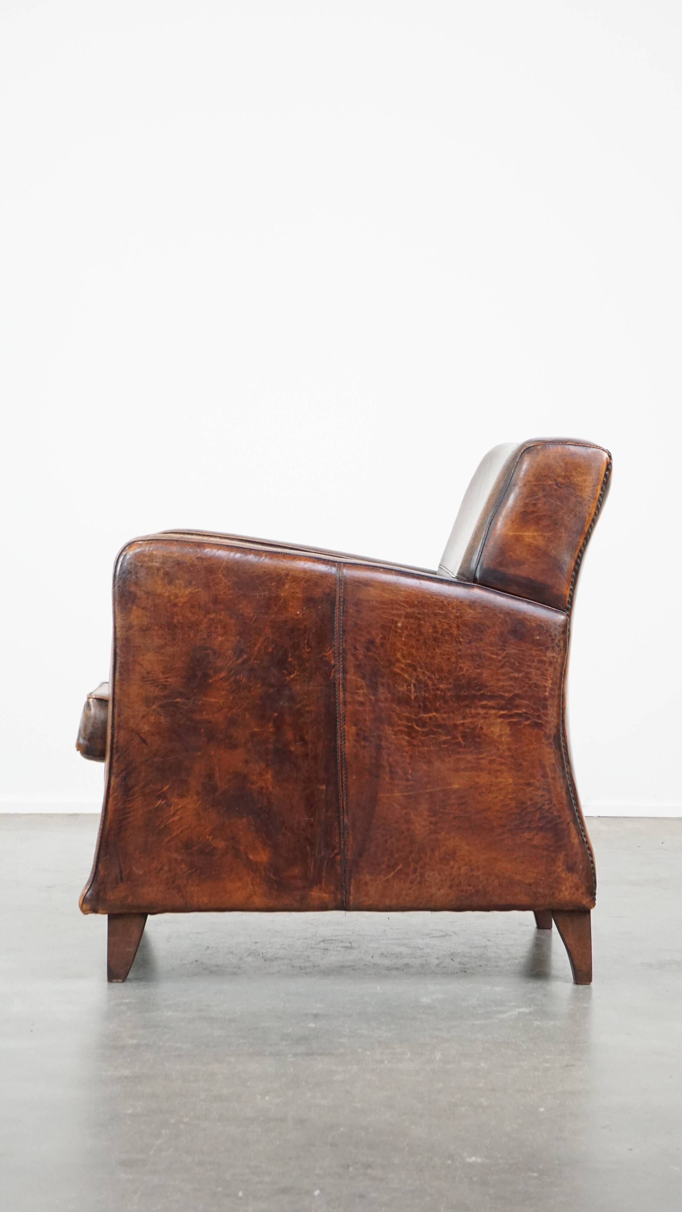 Dark brown design armchair made of sheepskin leather