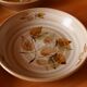 Four bowl-shaped plates in vintage Niderviller stoneware with plant decoration