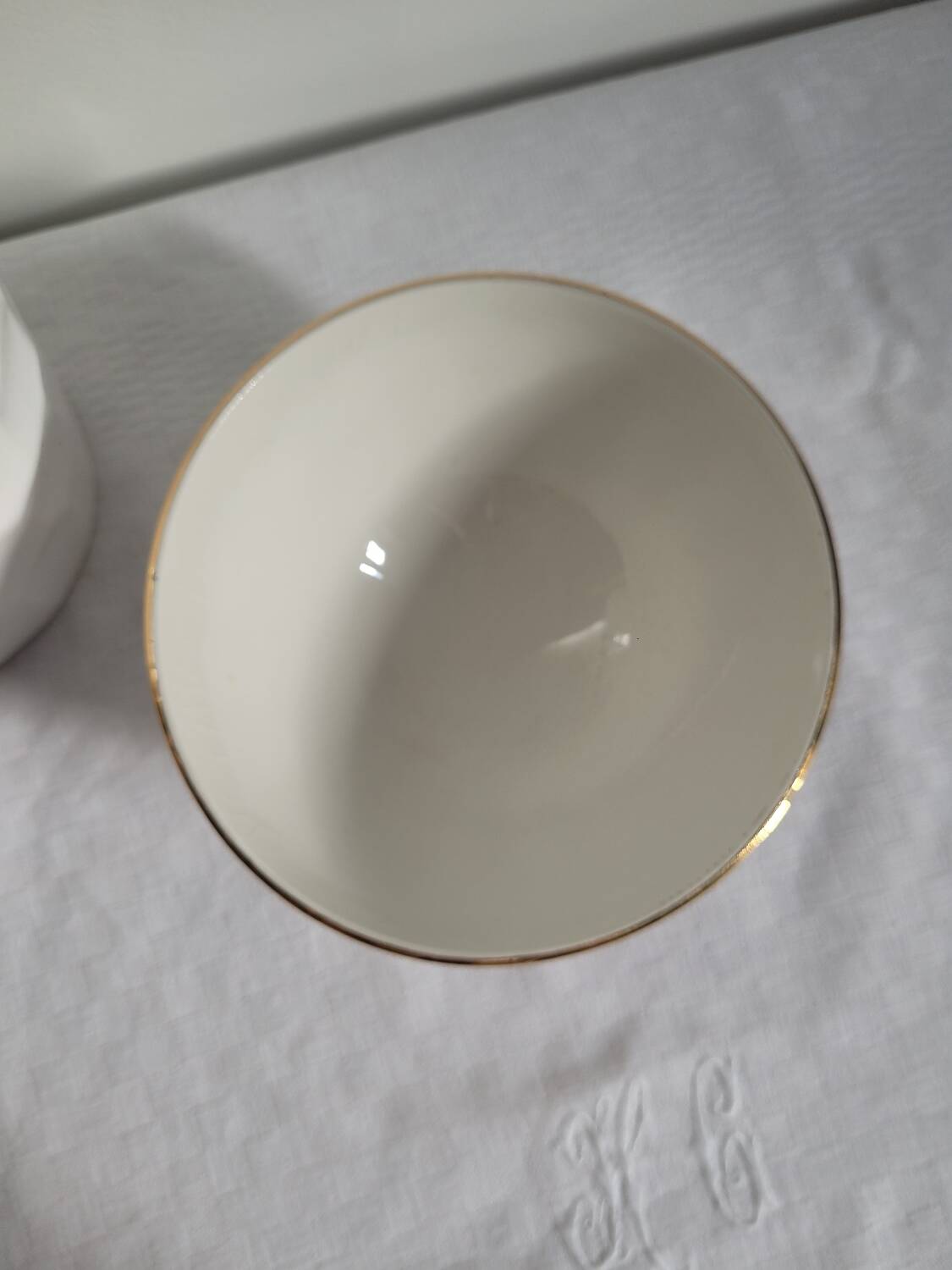 Opaque porcelain bowl with gold trim