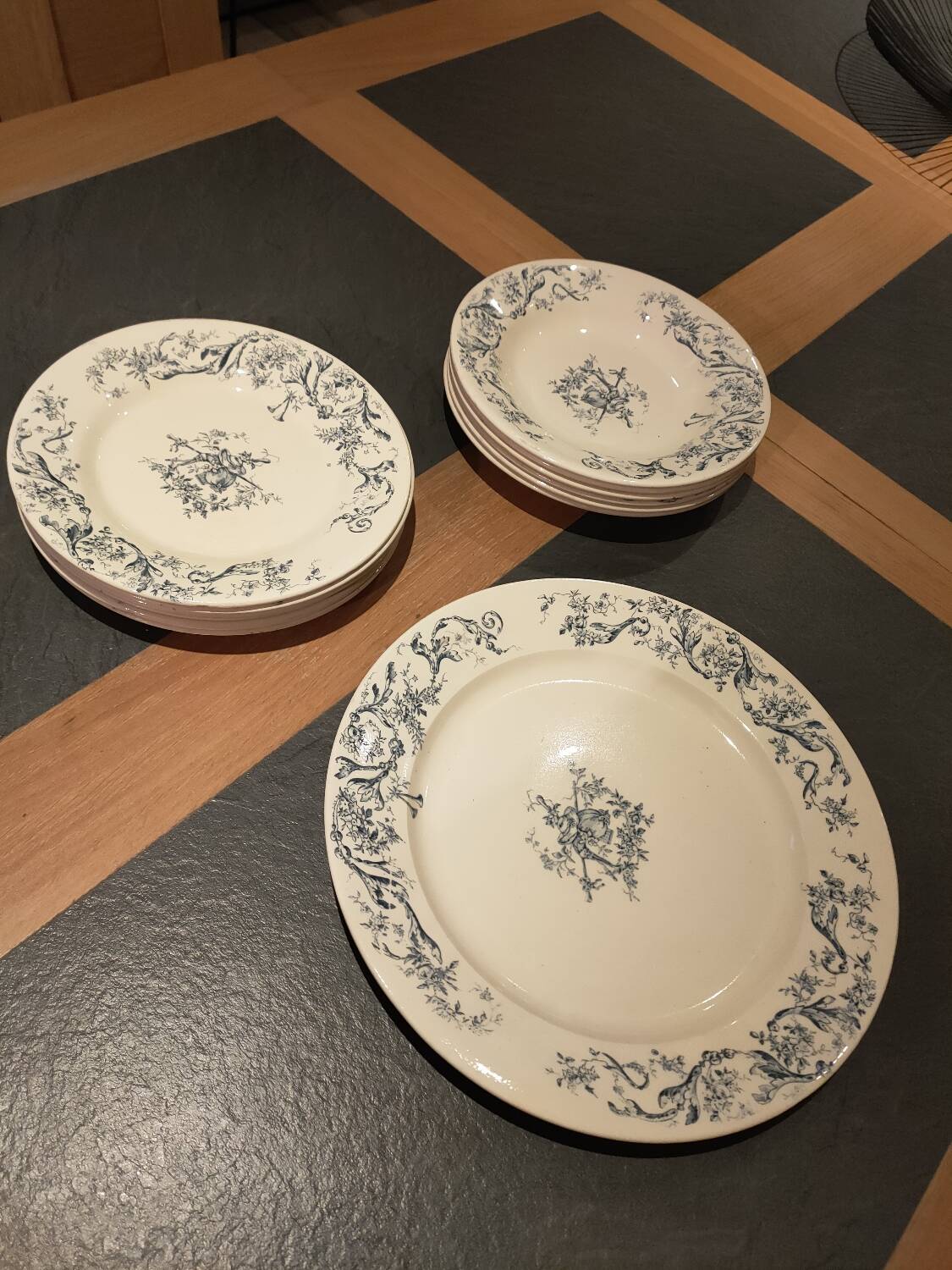 Service of old Gien earthenware plates and dishes