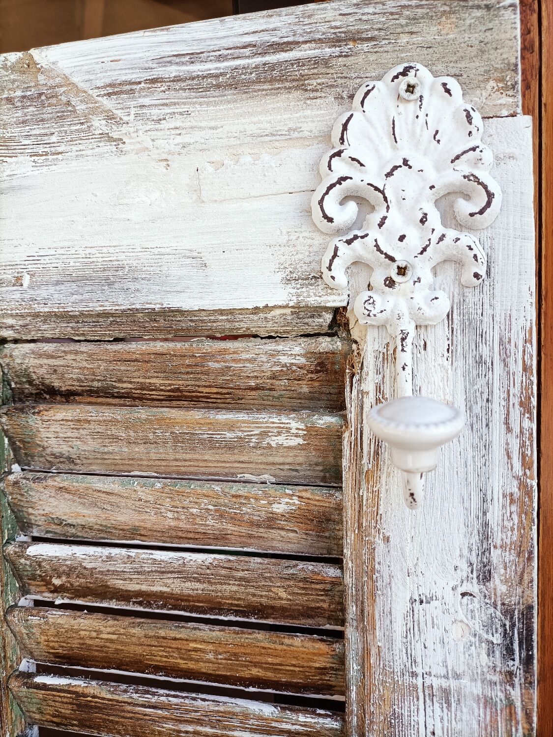 Vintage shutter renovated into a coat rack
