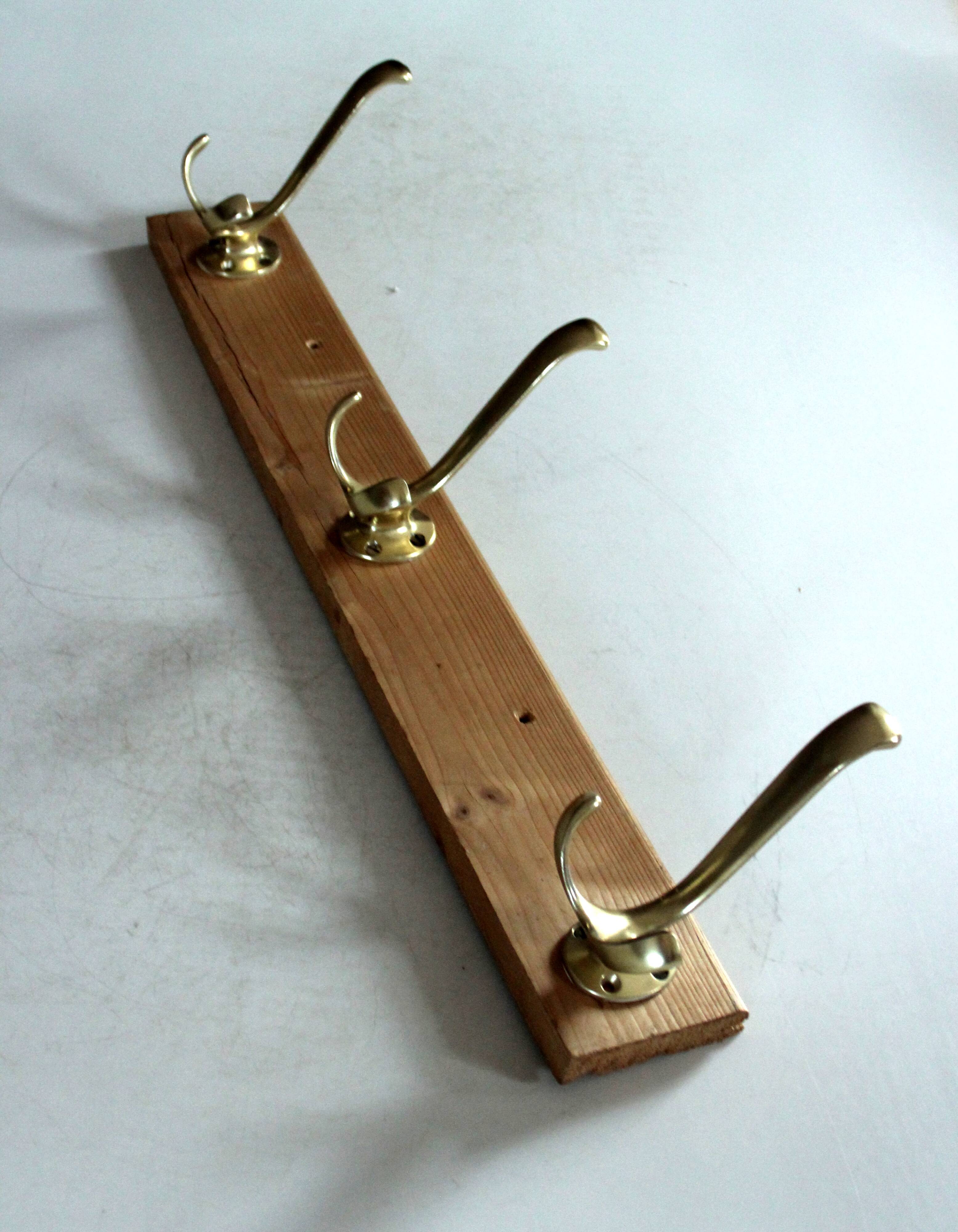 Wall mounted wooden coat rack with 3 brass hooks, vintage from the 50s