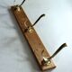 Wall mounted wooden coat rack with 3 brass hooks, vintage from the 50s
