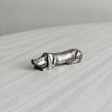 Antique metal knife rest in the shape of a dog.