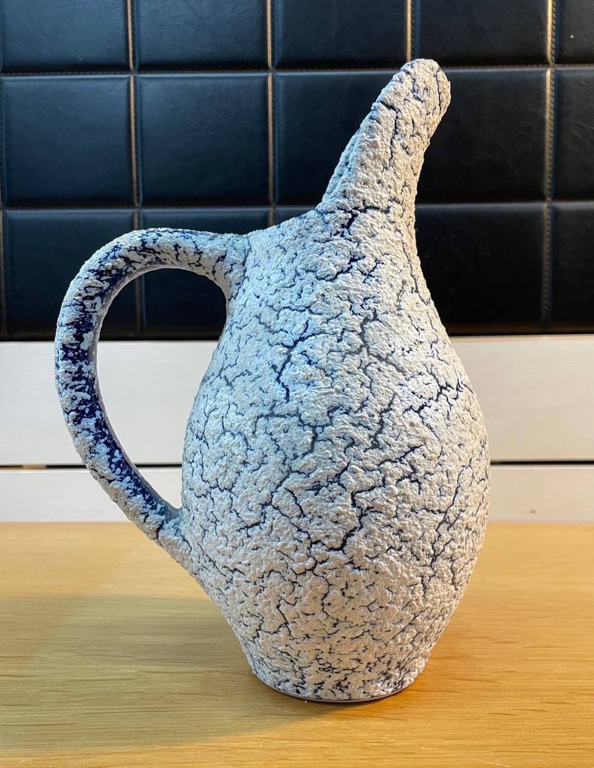 White and blue crisped ceramic pitcher
