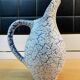 White and blue crisped ceramic pitcher