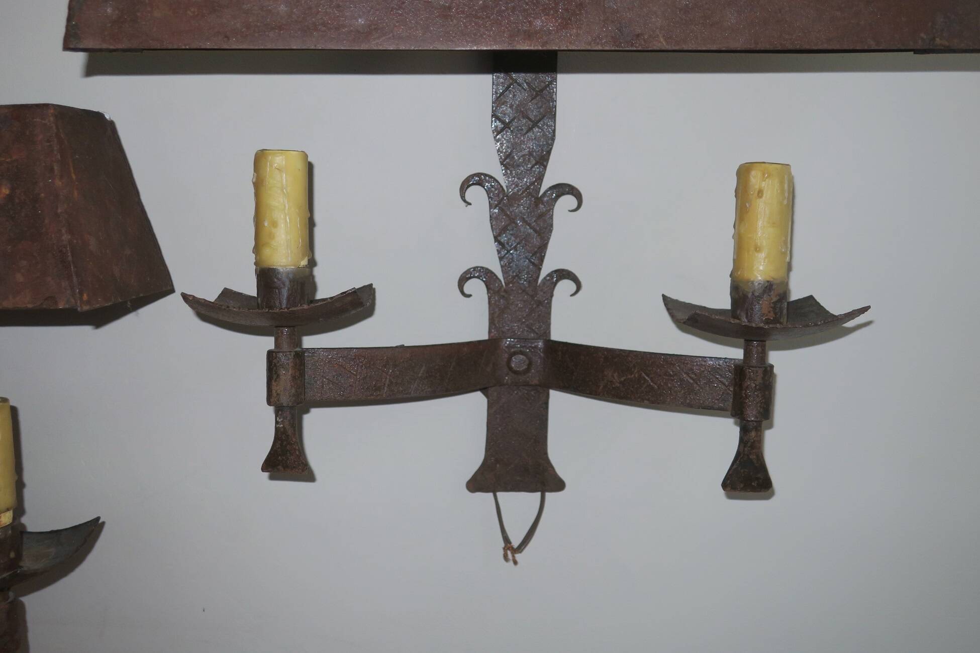Pair of mid century Brutalist patinated iron wall lights, 1950s-60s
