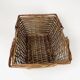 Old basket made of woven wood splices and braided wicker