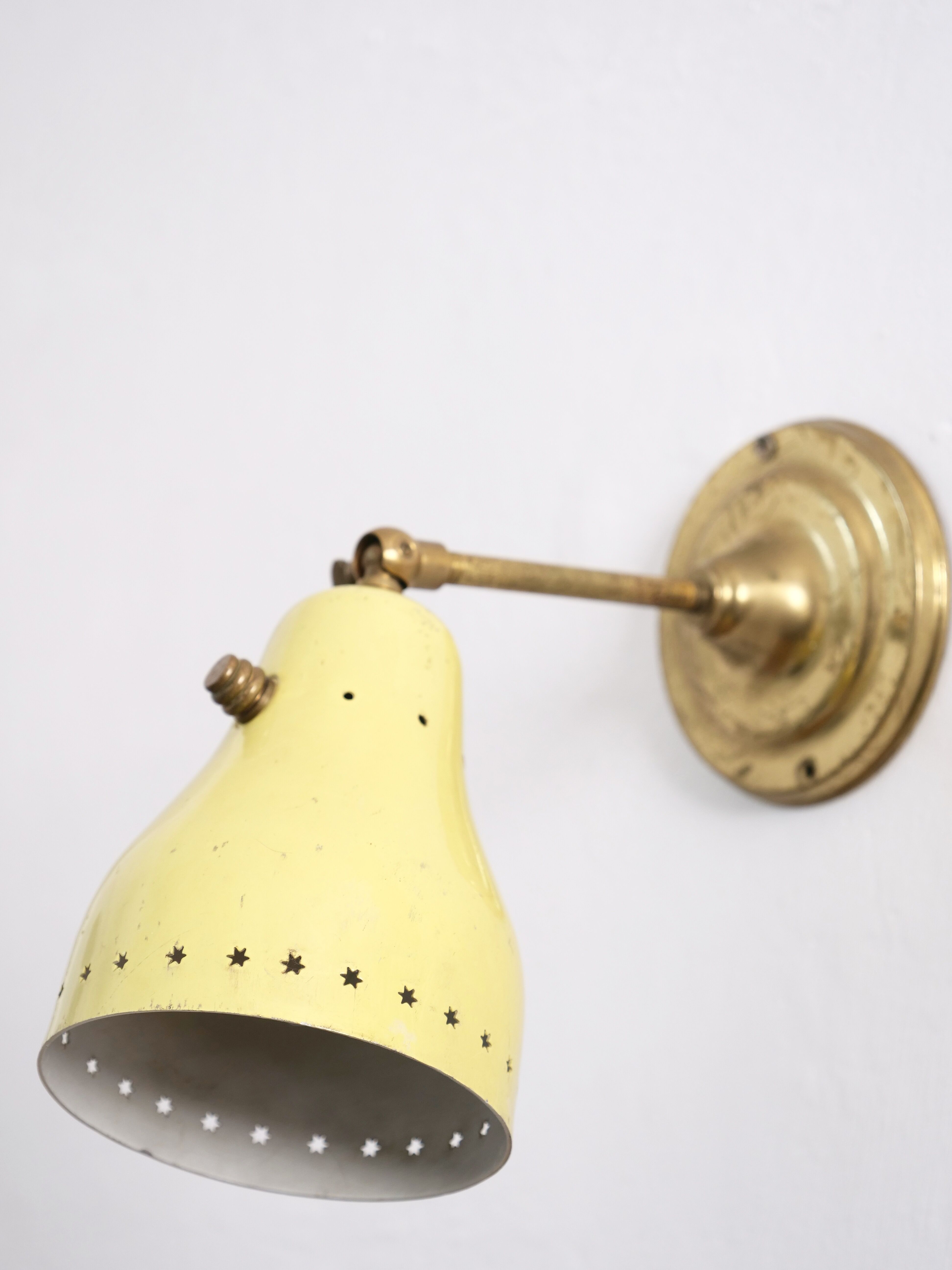 Wall lamp inlaiton and pale yellow lacquered metal