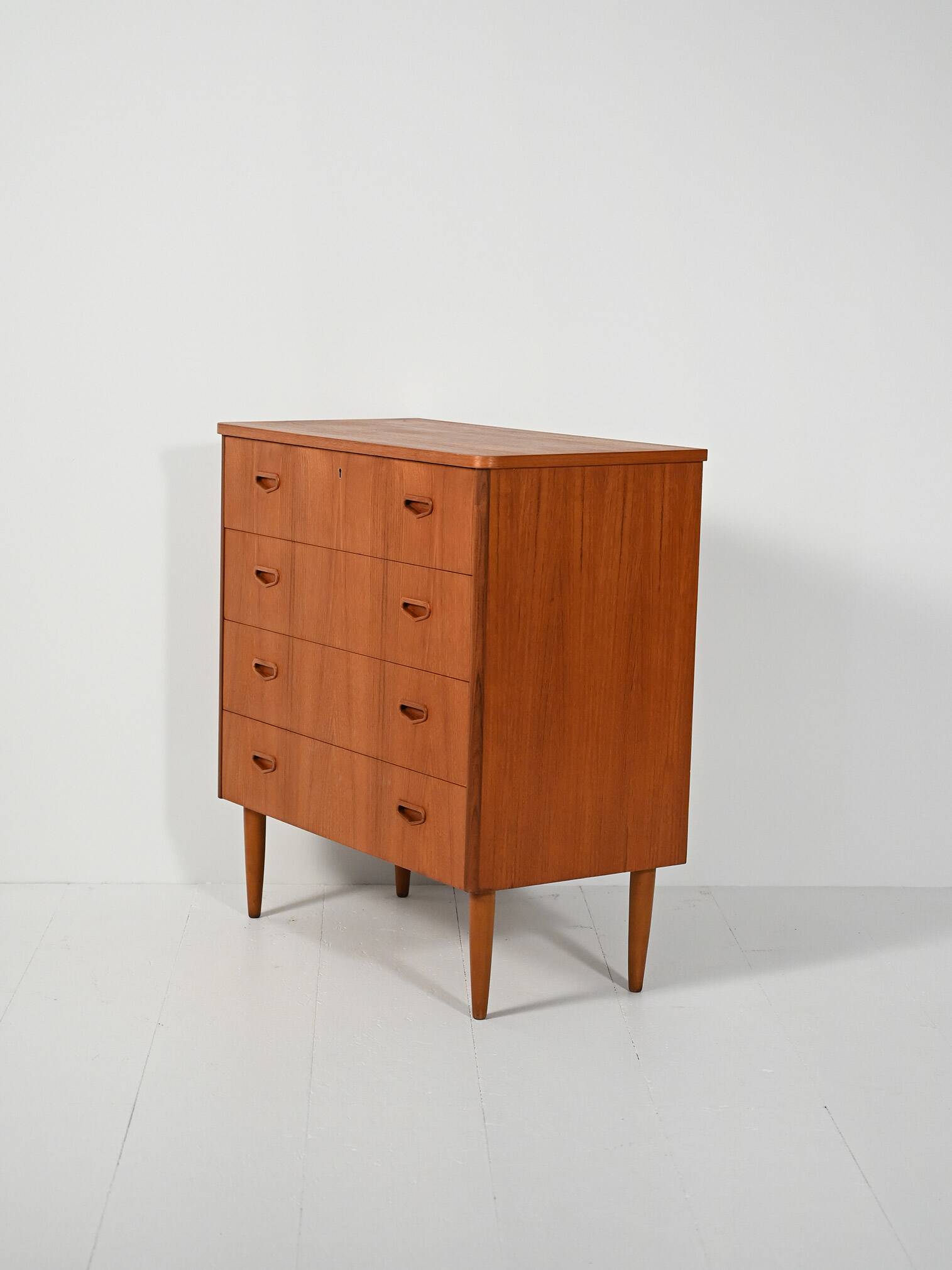 Scandinavian teak chest of drawers with sculpted recessed pulls