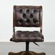 Chesterfield office chair in English style made of cow leather and wood.