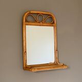 Arched rattan mirror with shelf. 1960.