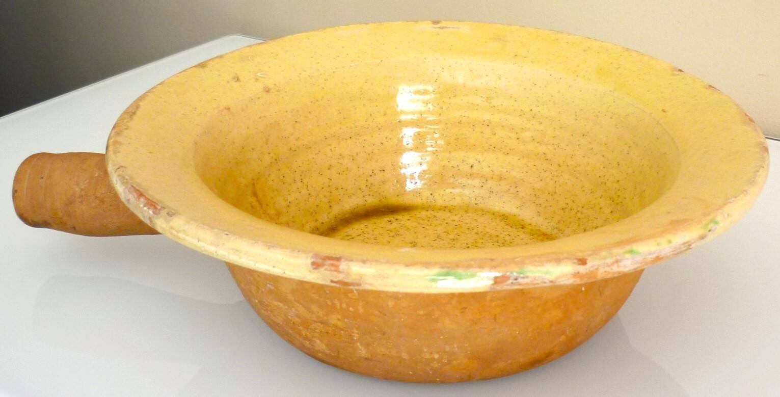 Frying pan, old caquelon, yellow glazed earthenware from the south of France.