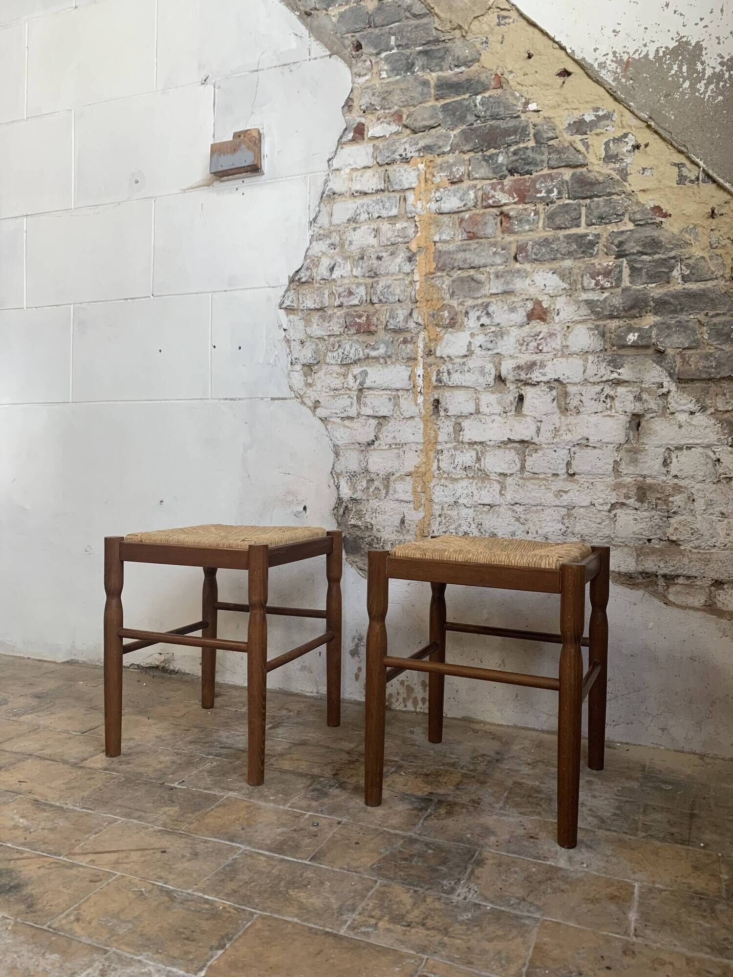 Pair of 20th century wooden stools with straw seats