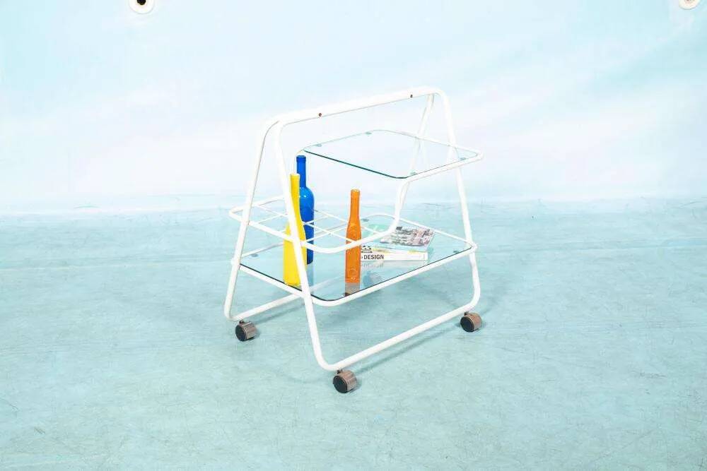 Space age dessert trolley from the 1970s, with metal tubes and glass trays.