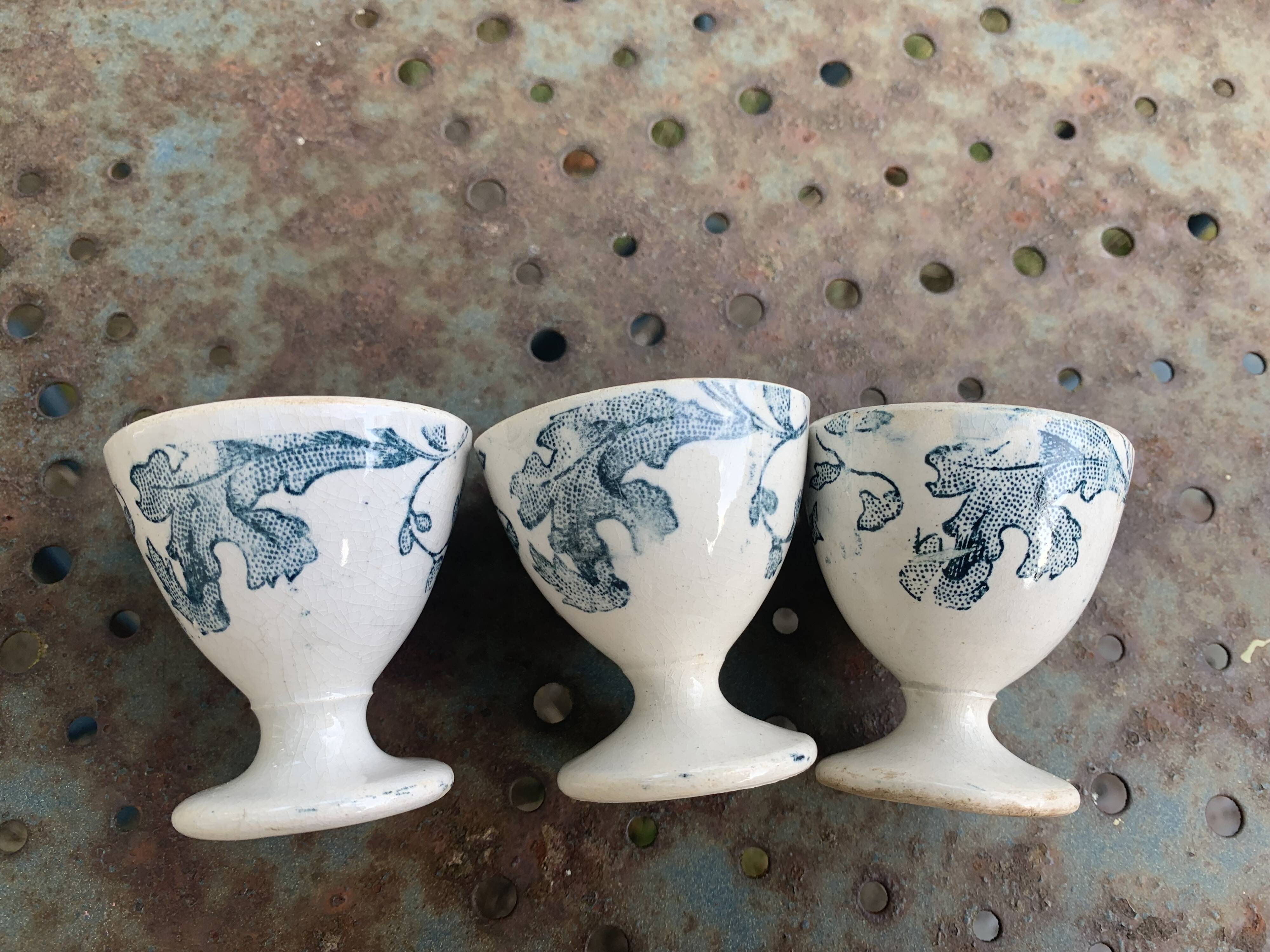 3 white earthenware egg cups, blue foliage decor, Grigny fire clay, made in France