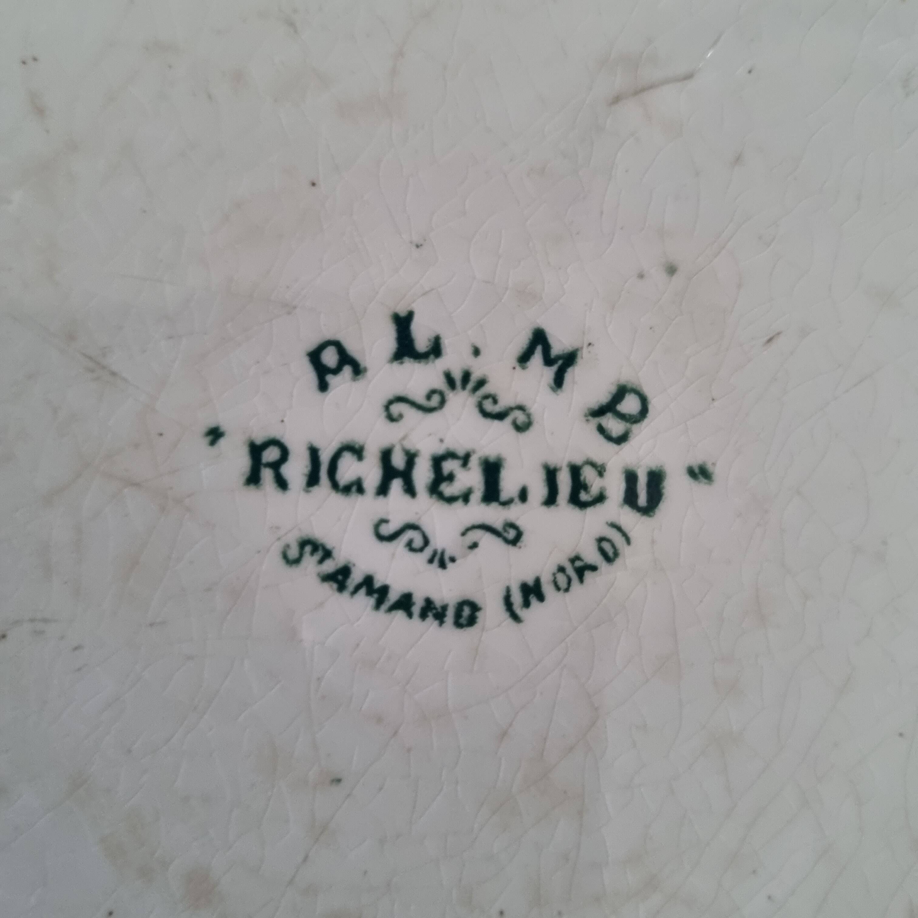 Antique plate in Saint Amand faience