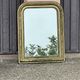 Louis Philippe mirror in gilded wood with an openwork frieze.