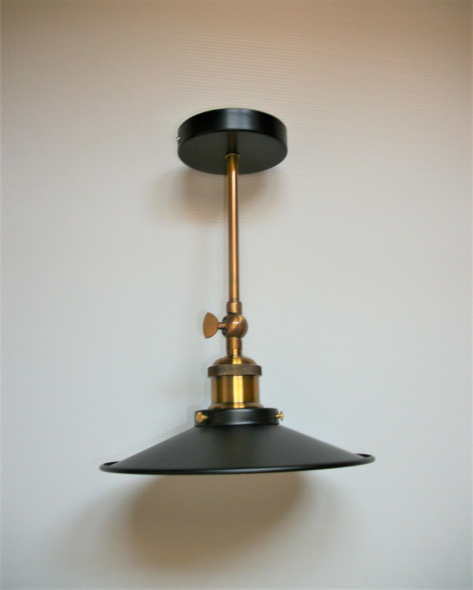 Pair of metal wall lamps in black and gold