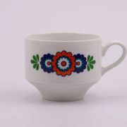 7 white porcelain cups from Winterling with coloured patterns.