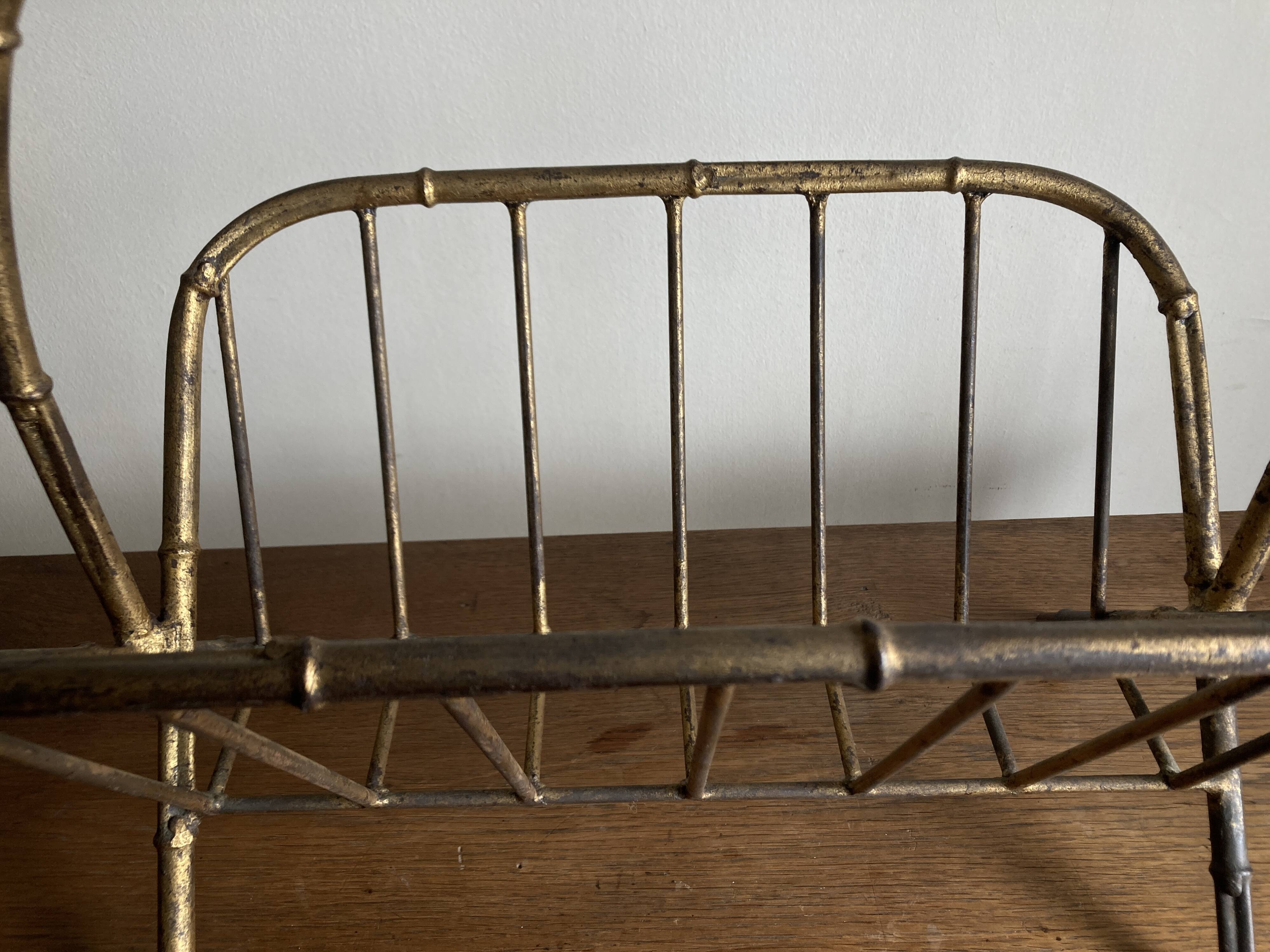 1960s magazine rack in gilded wrought iron, faux bamboo, Italian work