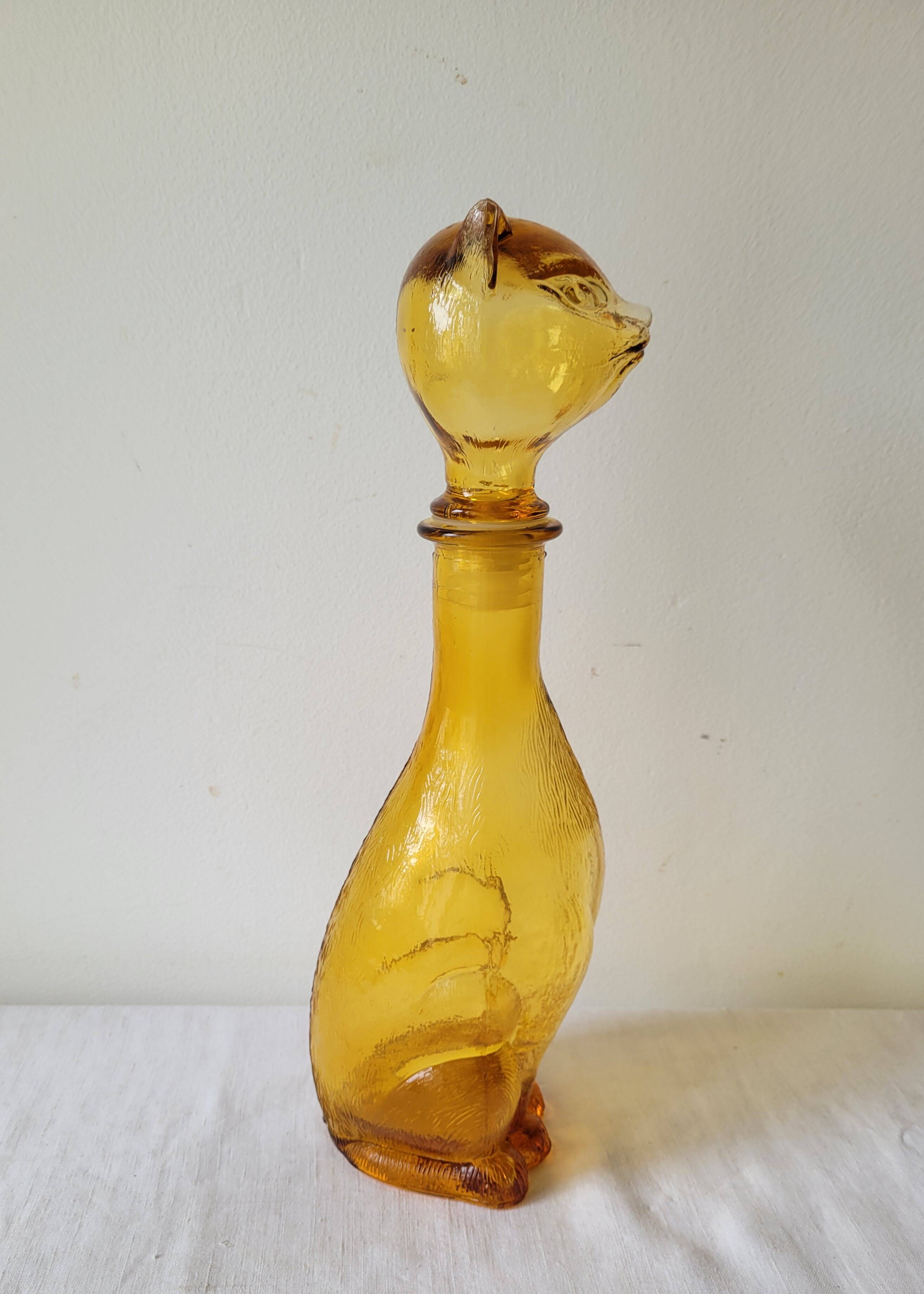 Zoomorphic carafe in amber glass