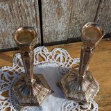 Pair of chiseled metal candle holders