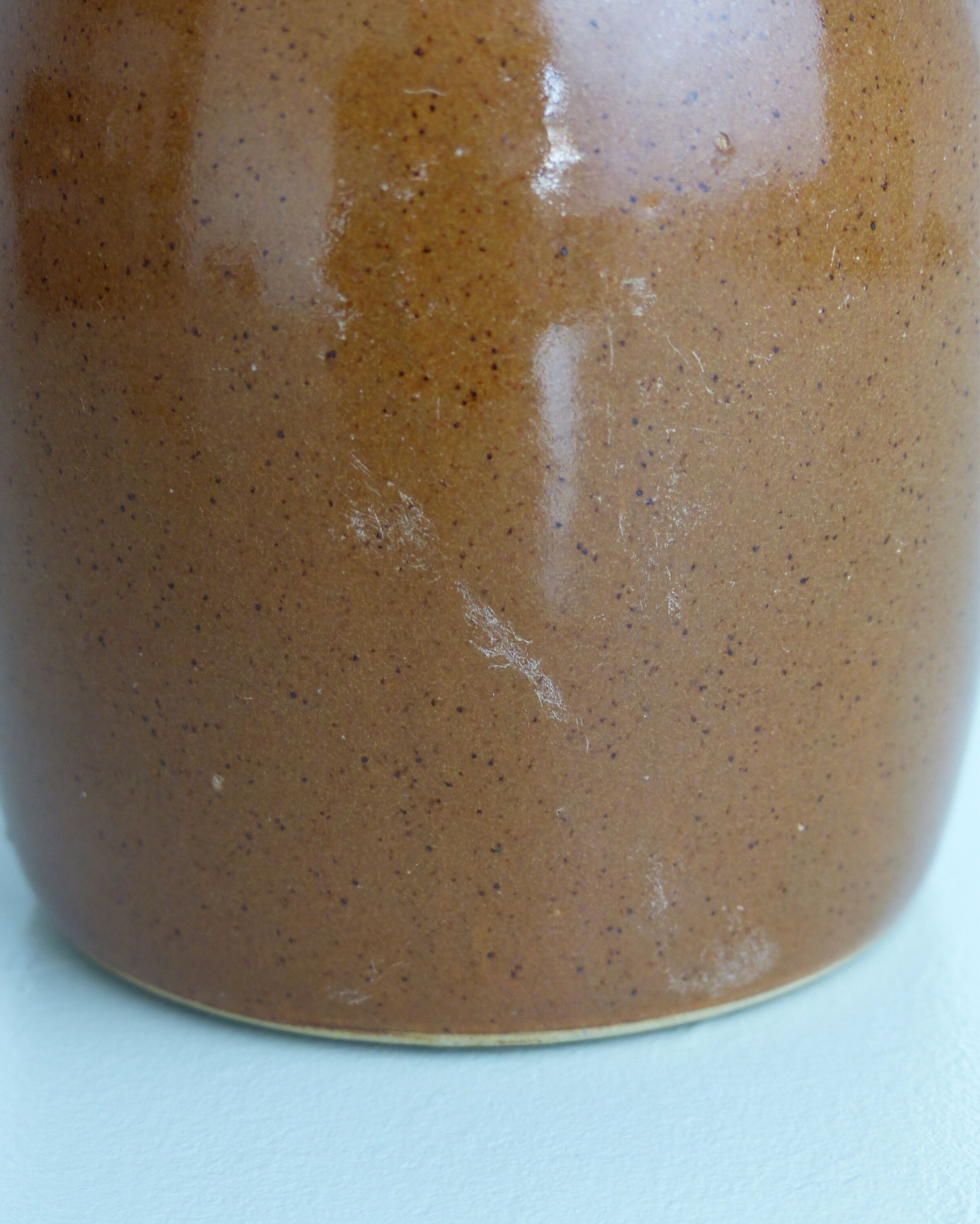 Pitcher or milk pot in speckled enamelled sandstone